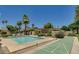 Community amenities with a swimming pool and shuffleboard, perfect for outdoor activities and recreation at 4525 N 66Th St # 55, Scottsdale, AZ 85251