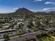 Scenic aerial view showcasing the community's lush landscaping and the nearby mountain backdrop at 4800 N 68Th St # 225, Scottsdale, AZ 85251