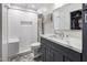 Stylish bathroom with a walk-in shower, modern vanity, and a view of the walk-in closet at 4800 N 68Th St # 225, Scottsdale, AZ 85251