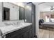 Elegant bathroom features a modern vanity with a marble countertop and a mirrored medicine cabinet at 4800 N 68Th St # 225, Scottsdale, AZ 85251