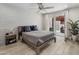 Inviting bedroom with a cozy bed, brick wall, and sliding door access to the outdoor patio at 4800 N 68Th St # 225, Scottsdale, AZ 85251