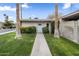 Charming home exterior with mature landscaping, a walkway, and a serene curb appeal at 4800 N 68Th St # 225, Scottsdale, AZ 85251