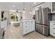 Bright kitchen featuring white cabinets, marble countertops, and stainless steel appliances at 4800 N 68Th St # 225, Scottsdale, AZ 85251