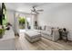 Cozy living room features a comfortable sofa, brick accent wall, and access to the outdoor patio at 4800 N 68Th St # 225, Scottsdale, AZ 85251