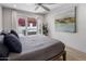 Comfortable main bedroom featuring a peaceful view of the outdoor patio and art piece at 4800 N 68Th St # 225, Scottsdale, AZ 85251