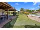 Practice your short game on the putting green, complete with red flags and desert landscaping at 4800 N 68Th St # 225, Scottsdale, AZ 85251
