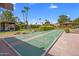 Enjoy outdoor fun with a shuffleboard court surrounded by palm trees and manicured landscaping at 4800 N 68Th St # 225, Scottsdale, AZ 85251