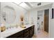 Updated bathroom featuring double sinks, granite counters, tile flooring and access to shower and toilet at 5139 N 76Th Pl, Scottsdale, AZ 85250