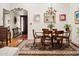 Dining area with a chandelier, and a view of the front entrance and living space at 5139 N 76Th Pl, Scottsdale, AZ 85250