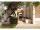 Gated front entrance with mature desert landscaping and terra cotta roofing at 5139 N 76Th Pl, Scottsdale, AZ 85250