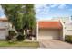 Charming home featuring a terra cotta tile roof, a two-car garage and mature desert landscaping at 5139 N 76Th Pl, Scottsdale, AZ 85250