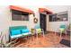 Private front patio with brick flooring, comfortable seating, and a secure entrance at 5139 N 76Th Pl, Scottsdale, AZ 85250