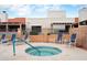 Inviting community hot tub with surrounding lounge chairs for relaxation and socializing at 5139 N 76Th Pl, Scottsdale, AZ 85250