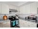 Well-lit kitchen with granite countertops, stainless steel appliances, and ample cabinet storage at 5139 N 76Th Pl, Scottsdale, AZ 85250