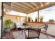 Comfortable covered patio with garden view featuring overhead lighting and comfortable seating at 5139 N 76Th Pl, Scottsdale, AZ 85250
