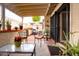 Cozy covered patio with stylish furniture and potted plants, perfect for outdoor relaxation at 5139 N 76Th Pl, Scottsdale, AZ 85250