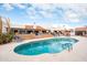 Community swimming pool with lounge chairs and meticulously kept landscaping for resort-style living at 5139 N 76Th Pl, Scottsdale, AZ 85250