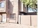 A view of the residence showing the architectural design, with beige siding, and a small yard at 5316 W Lynwood St, Phoenix, AZ 85043