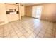 Spacious living room features tile flooring, light walls, and access to an outdoor patio at 5316 W Lynwood St, Phoenix, AZ 85043