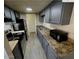 Efficient kitchen featuring stainless steel appliances, ample cabinets, and laminate countertops at 5420 W Lynwood St, Phoenix, AZ 85043