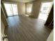 Living Room with new floors and sliding glass doors to the backyard at 5420 W Lynwood St, Phoenix, AZ 85043