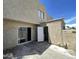 This patio area features stucco walls, sliding glass doors and a neutral colored floor at 5420 W Lynwood St, Phoenix, AZ 85043