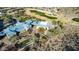 Stunning aerial view of the community clubhouse with blue roofs and the adjacent golf course at 583 W Bismark St, San Tan Valley, AZ 85143