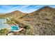 Stunning aerial view of the community pool and surrounding desert landscape at 583 W Bismark St, San Tan Valley, AZ 85143