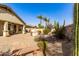 Charming backyard with a brick-paved patio, a built-in grill, and a desert-style landscape at 583 W Bismark St, San Tan Valley, AZ 85143