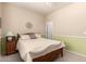 Well-lit bedroom featuring a cozy bed, bedside table, and soothing color scheme at 583 W Bismark St, San Tan Valley, AZ 85143
