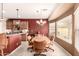 Charming dining area with a chandelier and large windows, creating a warm and inviting space at 583 W Bismark St, San Tan Valley, AZ 85143