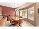 Cozy dining area featuring a chandelier, desert themed art, and abundant natural light from a large window at 583 W Bismark St, San Tan Valley, AZ 85143
