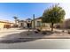 Single story home with desert landscaping and a spacious driveway at 583 W Bismark St, San Tan Valley, AZ 85143