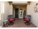 Welcoming front porch with comfortable chairs, offering a pleasant spot to relax at 583 W Bismark St, San Tan Valley, AZ 85143