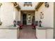 Inviting front porch with comfortable seating and decorative lighting, creating a cozy entrance at 583 W Bismark St, San Tan Valley, AZ 85143