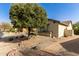 Single story home with desert landscaping and brick-lined walkway at 583 W Bismark St, San Tan Valley, AZ 85143