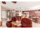 Inviting living room open to kitchen with plush seating and side tables at 583 W Bismark St, San Tan Valley, AZ 85143