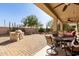 Covered patio with a built in grill and ample seating at 583 W Bismark St, San Tan Valley, AZ 85143