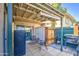 Cozy back patio area featuring tiled flooring, outdoor seating, and a grill for relaxing outdoor experience at 5962 W Townley Ave, Glendale, AZ 85302