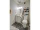 Neat bathroom with a white vanity and a dark gray bathmat on tiled flooring at 5962 W Townley Ave, Glendale, AZ 85302