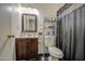 Practical bathroom with a vanity, toilet, and shower, offering essential functionality at 5962 W Townley Ave, Glendale, AZ 85302