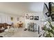 Dining area with a wooden table, tile floors, and attractive floral arrangements at 5962 W Townley Ave, Glendale, AZ 85302