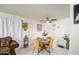 Cozy dining room featuring a wood table, tile floors, and stylish decorations at 5962 W Townley Ave, Glendale, AZ 85302