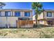 A two-story home with a fenced yard and green lawn at 5962 W Townley Ave, Glendale, AZ 85302