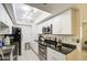 Bright, updated kitchen with stainless steel appliances, sleek countertops, and ample storage at 5962 W Townley Ave, Glendale, AZ 85302