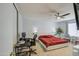 Spacious main bedroom featuring a large bed, a dedicated workspace, and comfortable seating at 5962 W Townley Ave, Glendale, AZ 85302