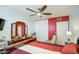 Cozy main bedroom with a large bed, dark wood furniture, and plenty of natural light at 5962 W Townley Ave, Glendale, AZ 85302