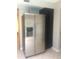 Stainless steel refrigerator is installed next to a black kitchen cabinet at 6010 E Mountain View Rd, Paradise Valley, AZ 85253