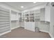 This walk-in closet is designed with built-in storage and a neutral color palette at 6331 E Phoenician Blvd # 6, Scottsdale, AZ 85251