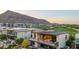 Stunning home showcasing a modern design, mountain views, open balconies, and lush landscaping at 6331 E Phoenician Blvd # 6, Scottsdale, AZ 85251